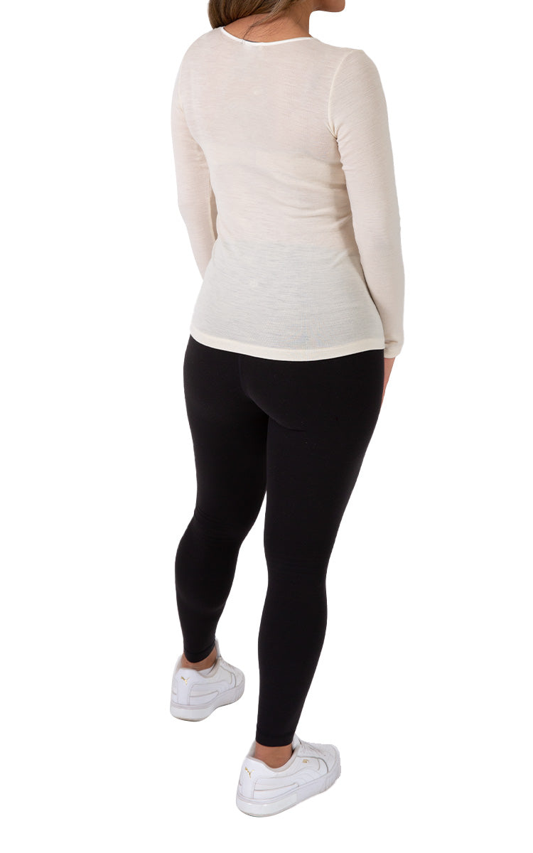 Woman wearing emmebivi wool long sleeve shirt in Ivory