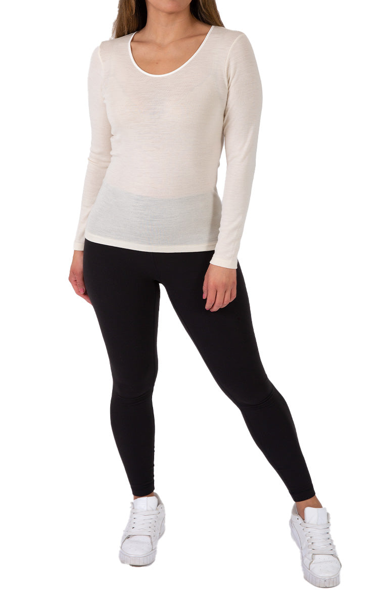 Woman wearing emmebivi wool long sleeve shirt in Ivory