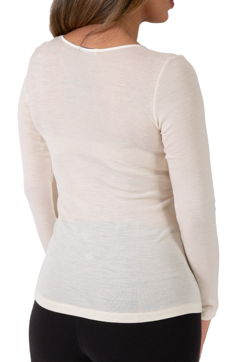 Woman wearing emmebivi wool long sleeve shirt in Ivory