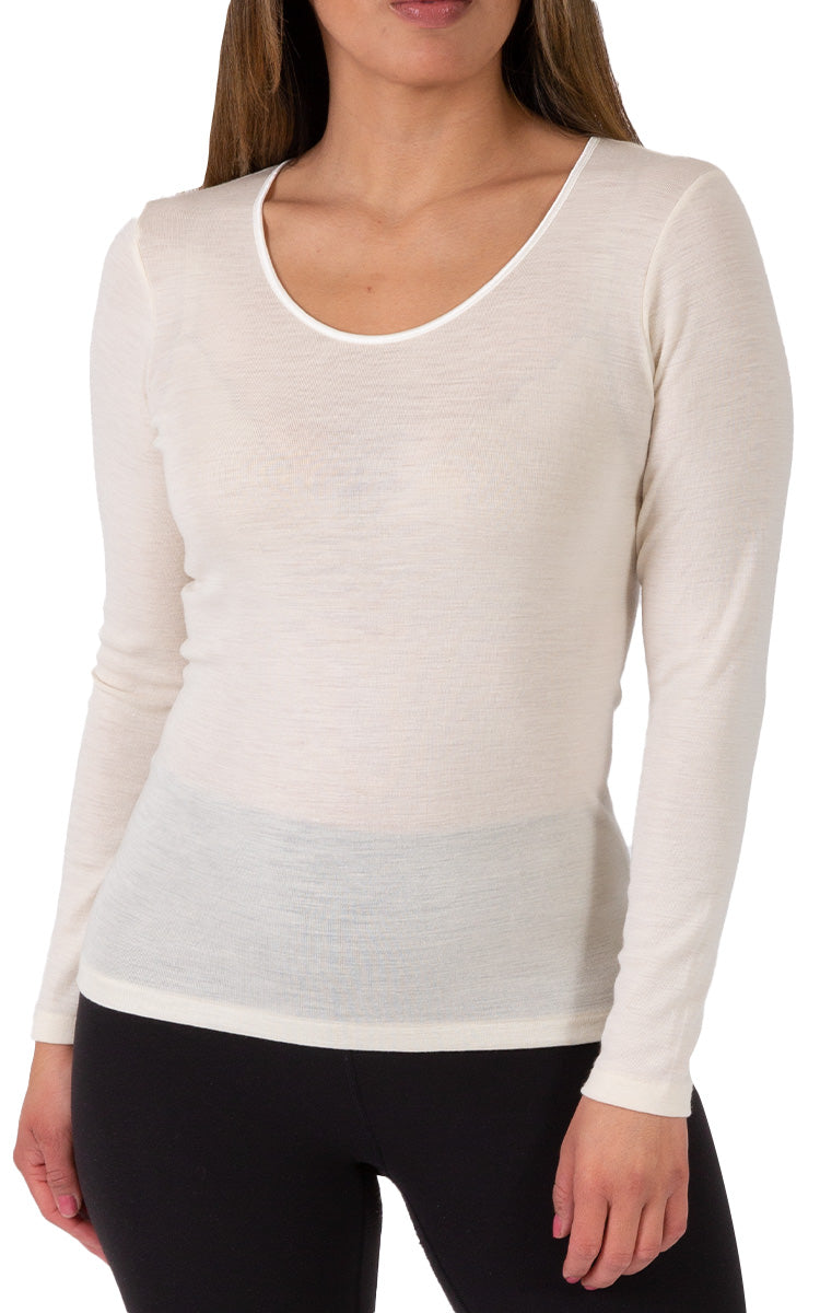 Woman wearing emmebivi wool long sleeve shirt in Ivory
