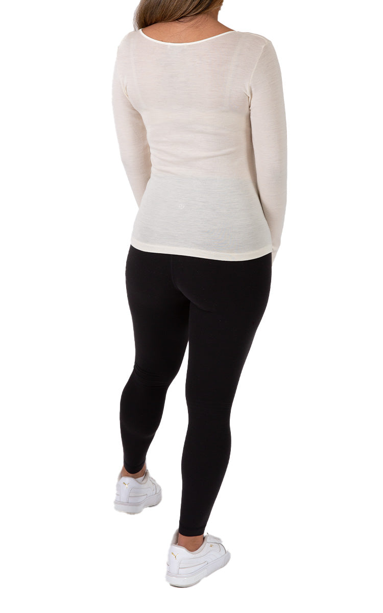 Woman wearing emmebivi cotton long sleeve shirt with lace neckline