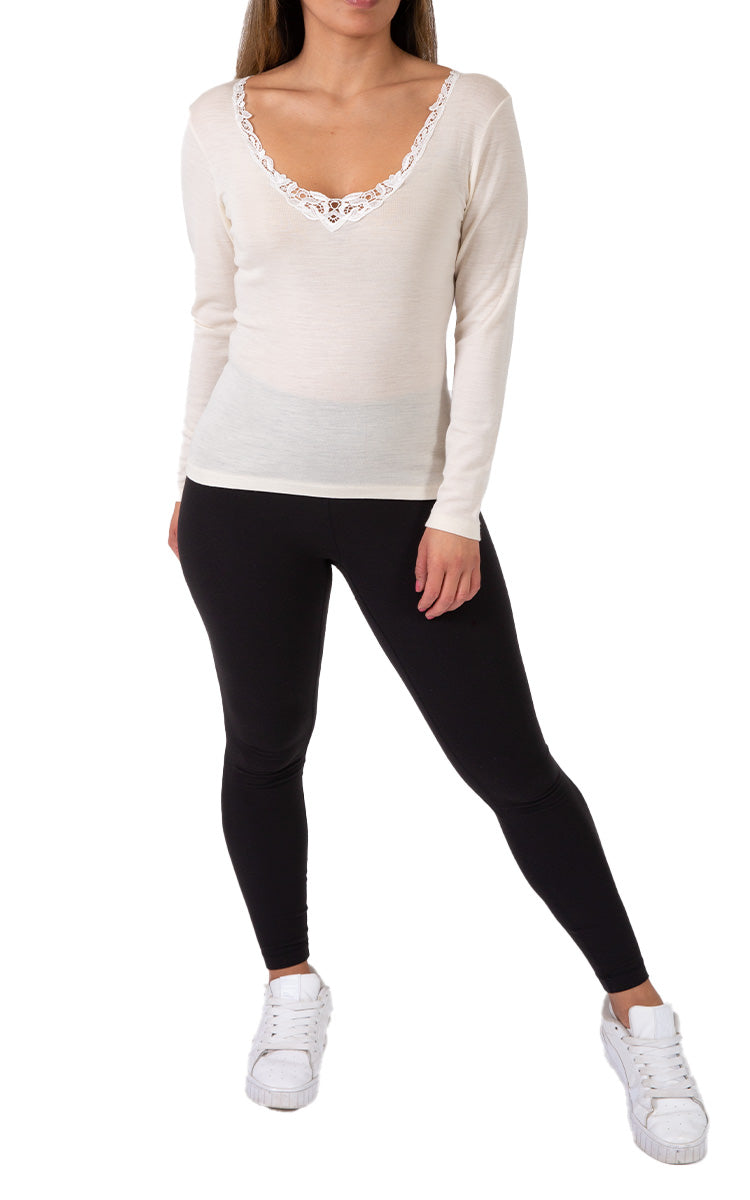 Woman wearing emmebivi cotton long sleeve shirt with lace neckline