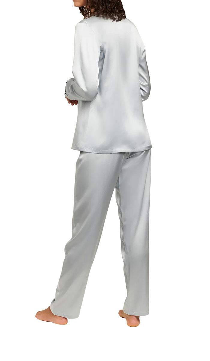 Woman wearing ginia silk pyjama in pearl blue