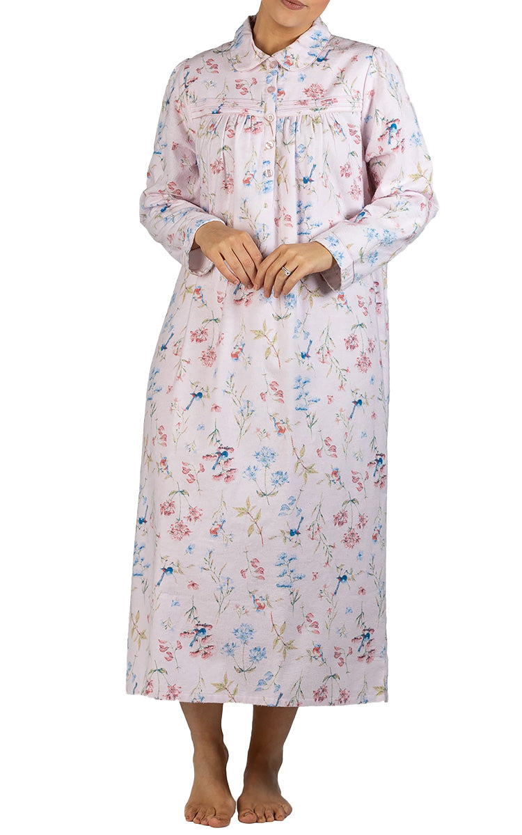 Woman modeling a warm flanelette nightgown for nursing homes 
