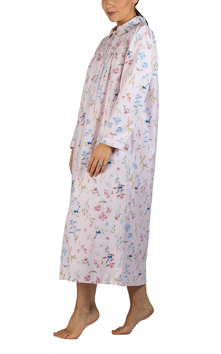 Woman modeling a warm flanelette nightgown for nursing homes 