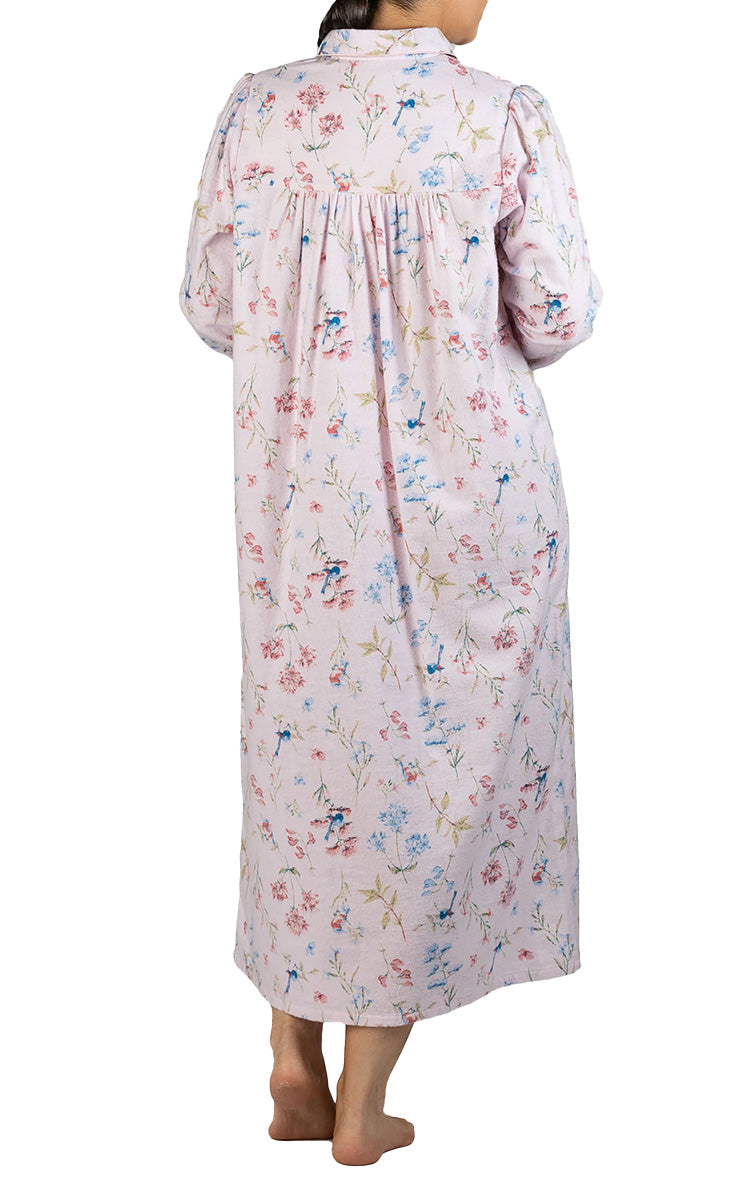 Woman modeling a warm flanelette nightgown for nursing homes 
