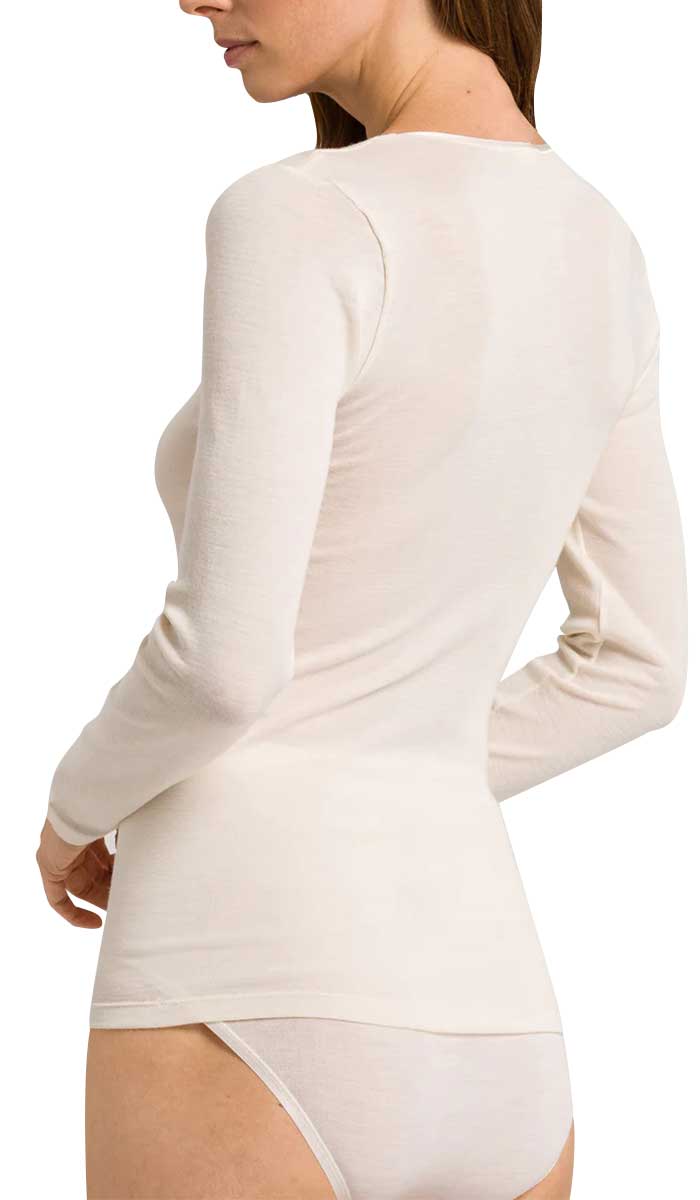 woman wearing hanro long sleeve shirt in ivory