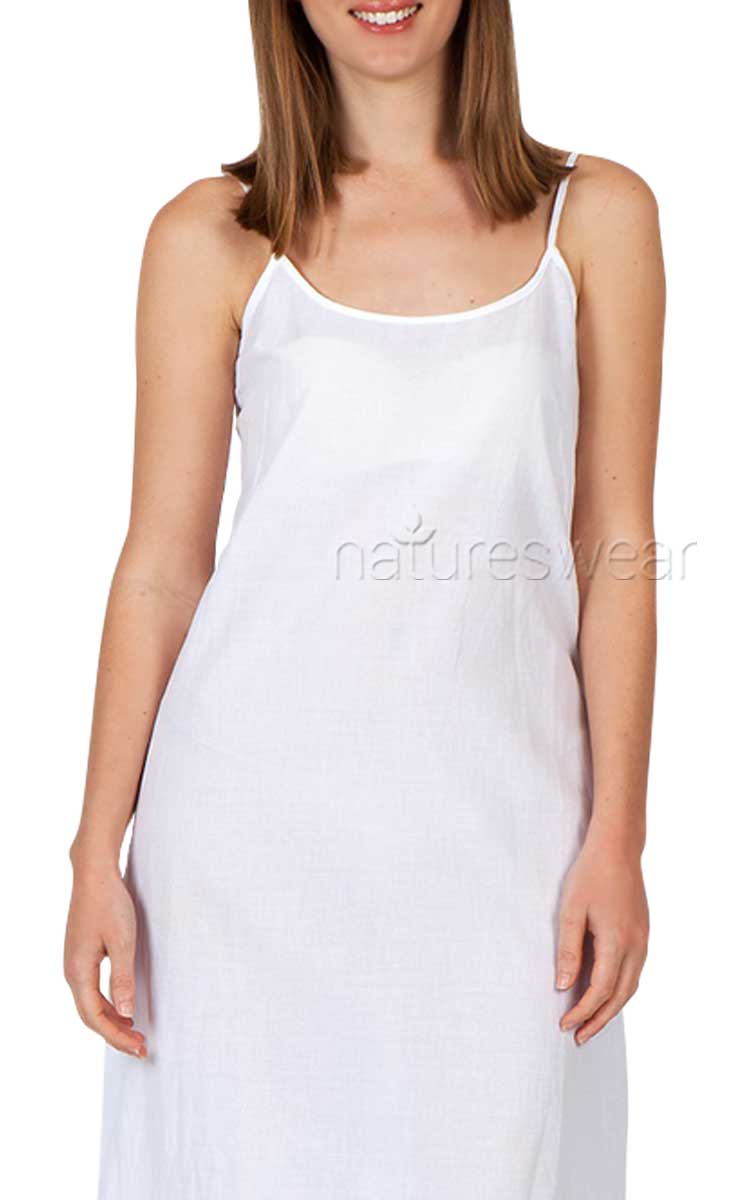 Woman wearing white cotton slip by Arabella